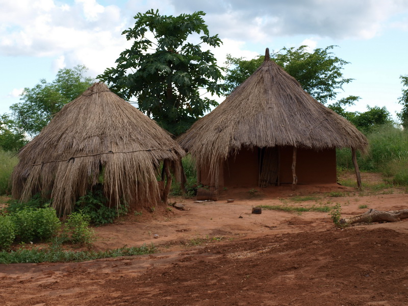 Kitchen and sleeping hut, Mr Capital\'s home in Chris\' Village, Kapululira